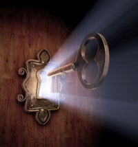 A close-up of a key moving towards the key hole.